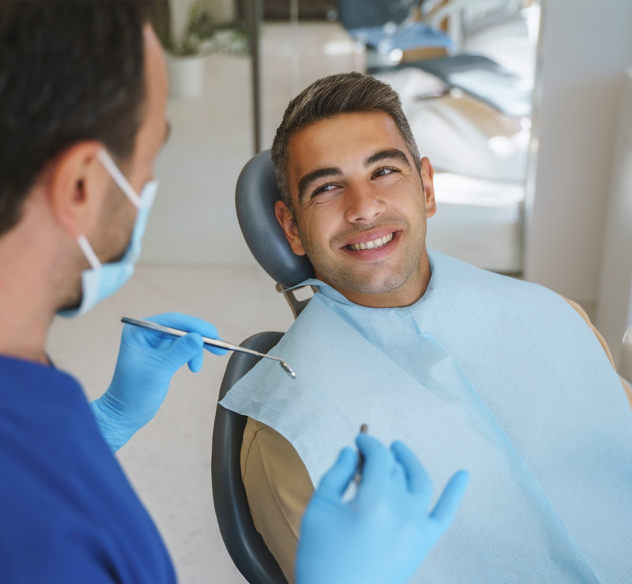 Dentist preparing to clean a patient's teeth
