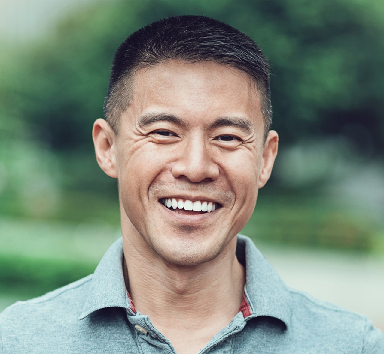a close up of a man smiling with healthy teeth